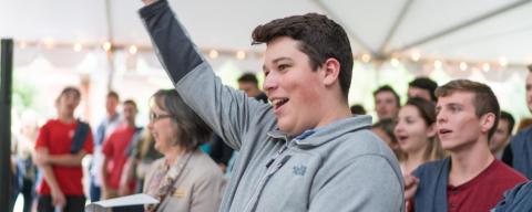 A student at FIRE carnival cheers