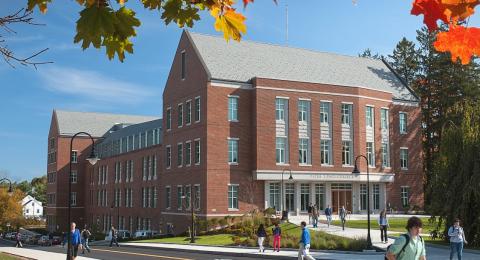 Paul College exterior with students