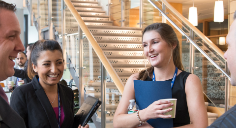 Sales students network with professionals at a sales center event