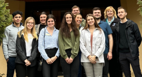 Dean's Ambassadors pose in front of the Ambassador Andrew J. Young International Building