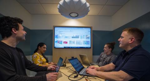 Masters in Business Analytics students studying a problem