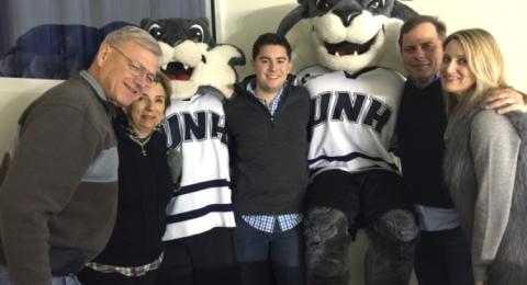 Armand Francouer ’65 COLA, Kay Ruma ’65 COLA, Colin Kelley ’12, Kevin Knarr ’91 and Emily Knarr at a UNH hockey game