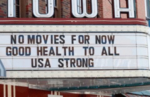 This Wednesday, April 1, 2020 file photo shows the marquee for the Iowa Theater, closed in response to the COVID-19 coronavirus outbreak, on John Wayne Drive in Winterset, Iowa. (AP Photo/Charlie Neibergall)