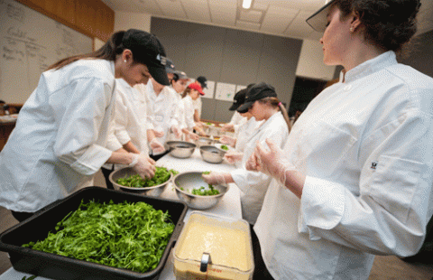 UNH Paul College HMGT Gourmet Dinner team prepping food