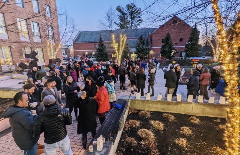 Paul College faculty and staff gather in the courtyard for a holiday party
