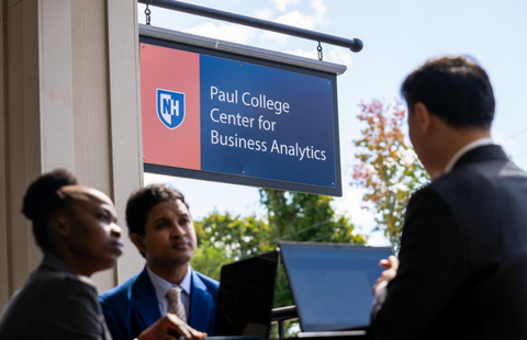 People sitting outside the UNH Center for Business Analytics 