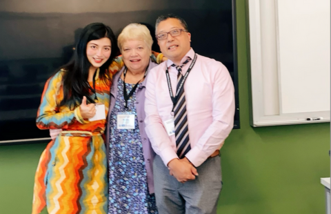 Presenters pose after a panel session