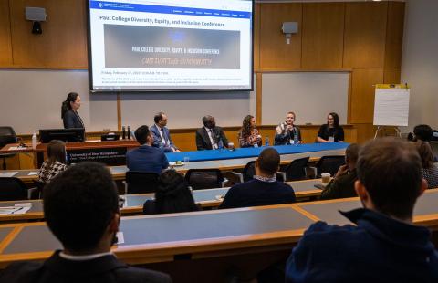 A row of panelists speak at the Paul College DEI conference