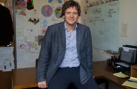 Loris Rubini at his desk at UNH Paul College.