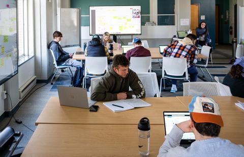 Students gathered in the forge for a class
