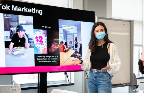 A student presenting on tiktok marketing techniques