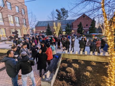 Paul College faculty and staff gather in the courtyard for a holiday party
