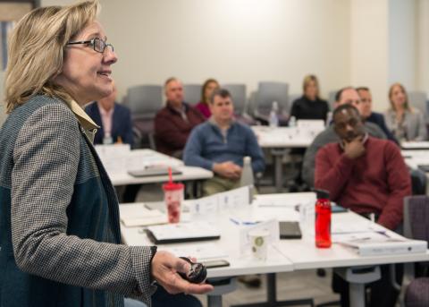 instructor and participants in the classroom