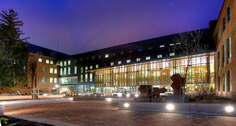 A view from the outside of Paul College at night.