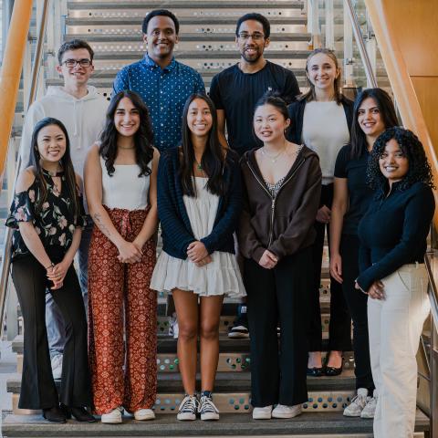 Our second cohort of inclusive leadership fellows stands as a group on the Paul College staircase.