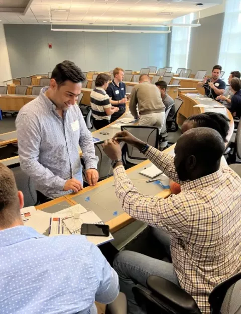 Students participate in an activity during graduate orientation.
