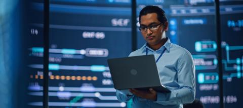 male_federal_employee_holding_a_laptop