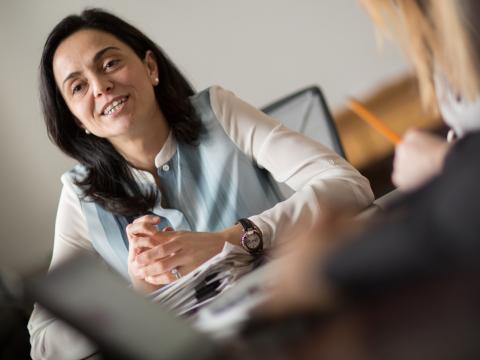 Professor smiles while teaching