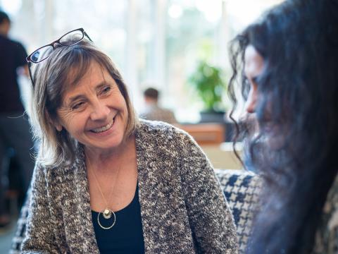 Professor smiles at student