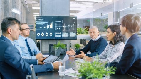 business analytics professionals in a management meeting